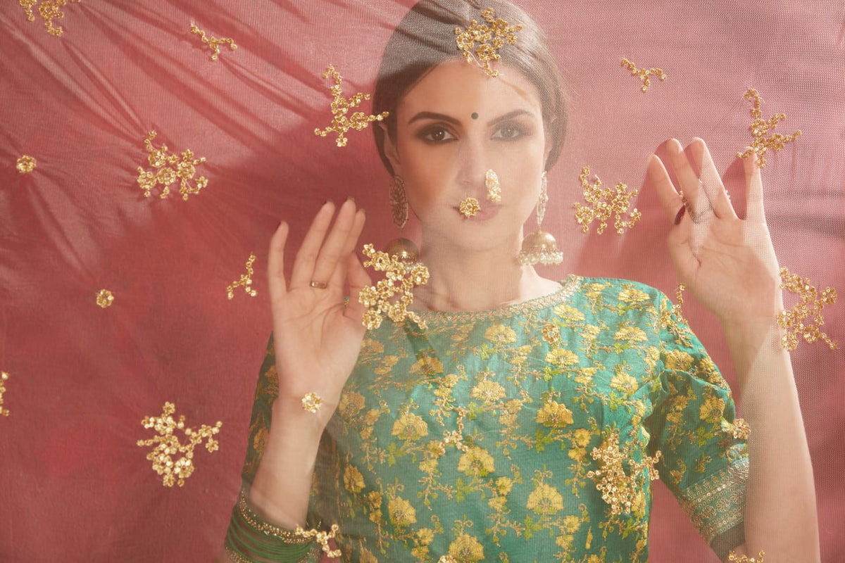 Ivory Floral Lehenga Choli with Emerald Green Embroidered Blouse & Net Dupatta