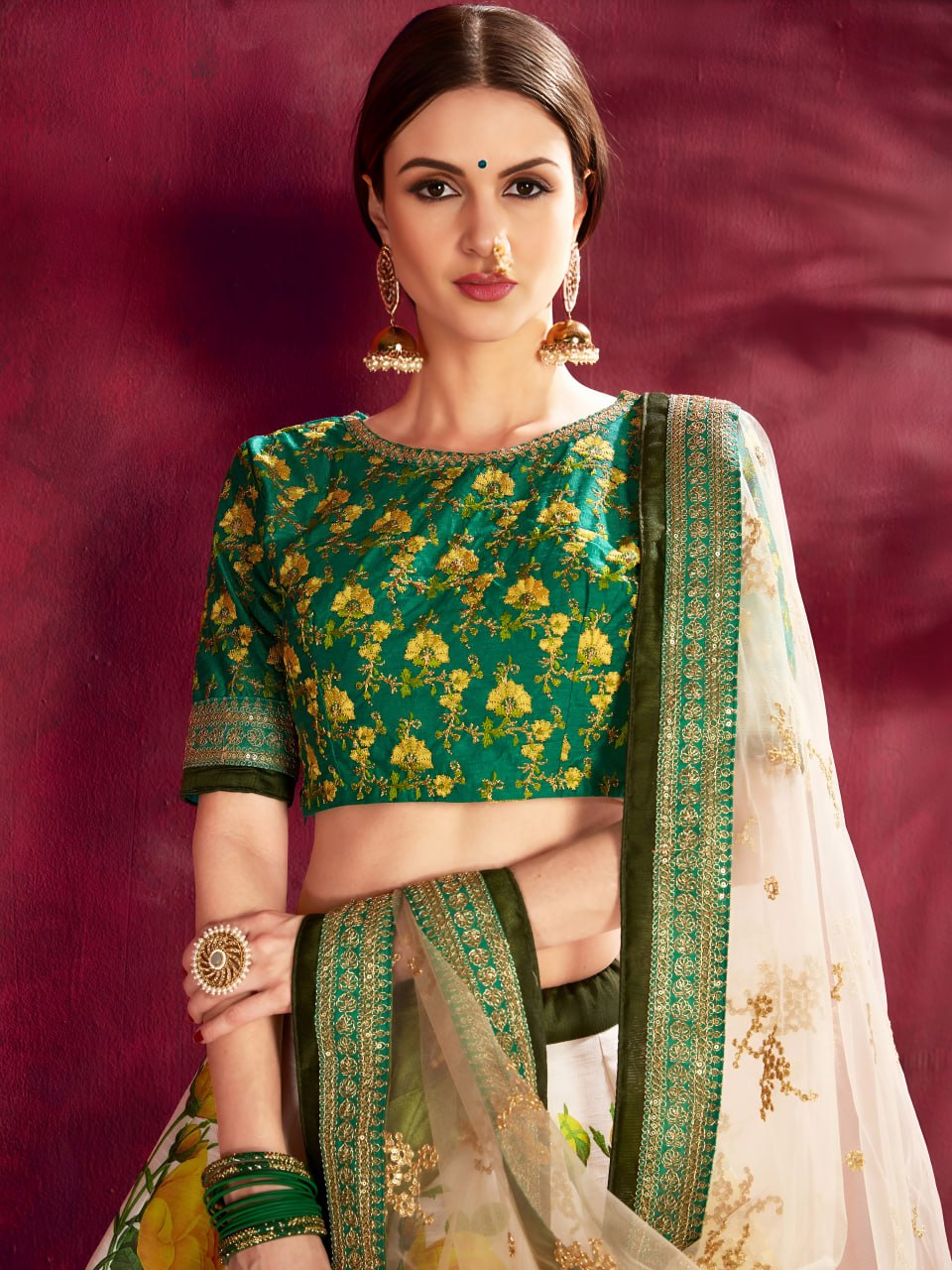 Ivory Floral Lehenga Choli with Emerald Green Embroidered Blouse & Net Dupatta