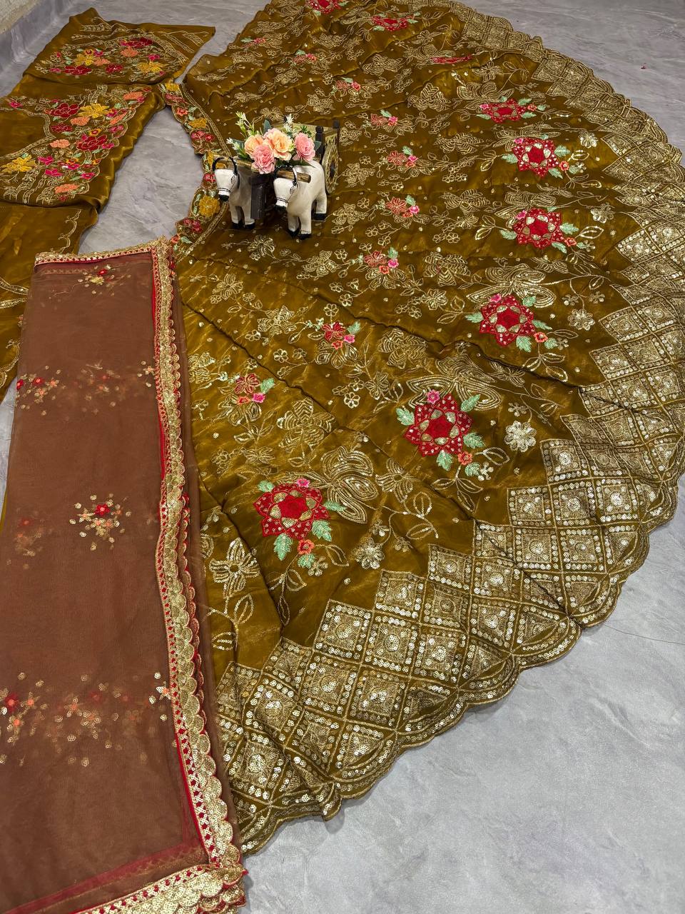 4 meter flared olive green lehenga twirl shot with can-can layers