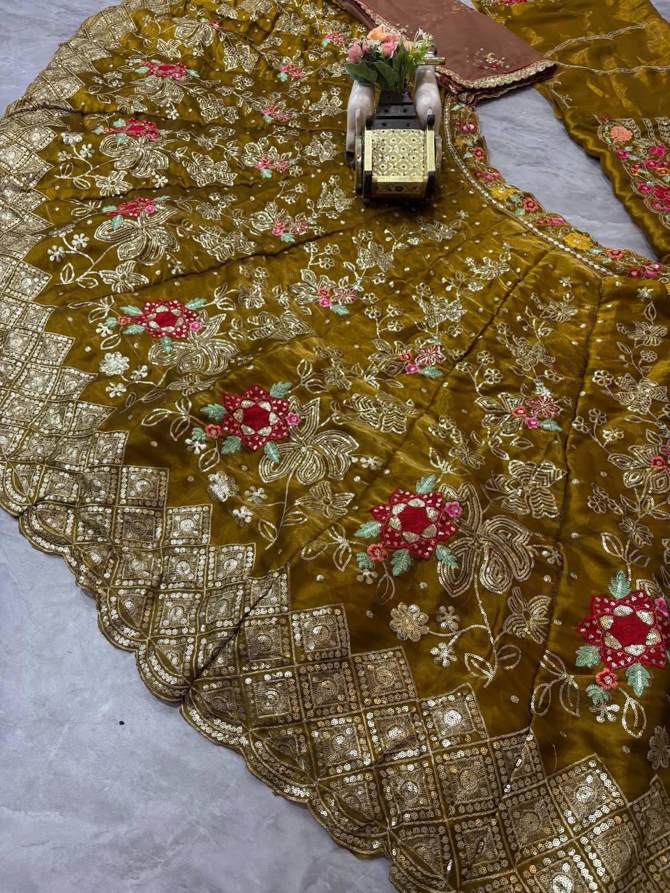 Olive green lehenga lower border embroidery close up