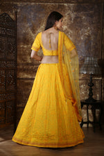 Yellow color designer lehenga choli for haldi function - Joshindia
