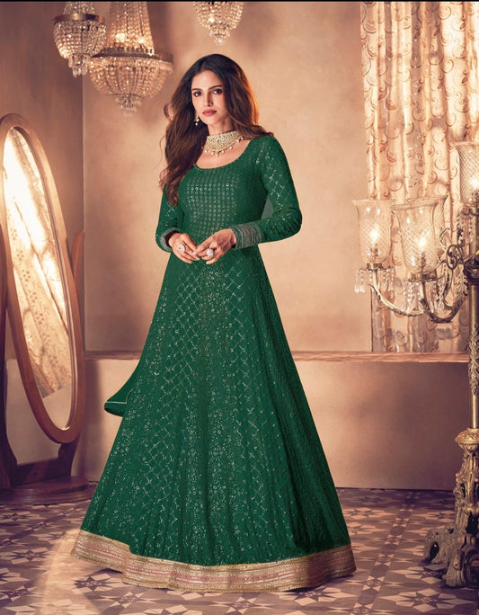 Green color fancy designer gown for wedding functions