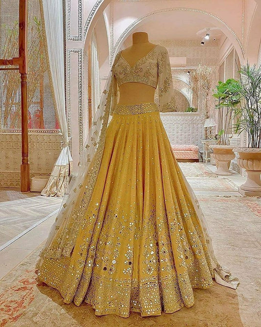 Trending Yellow color Mirror work Lehenga choli for Haldi wedding Function