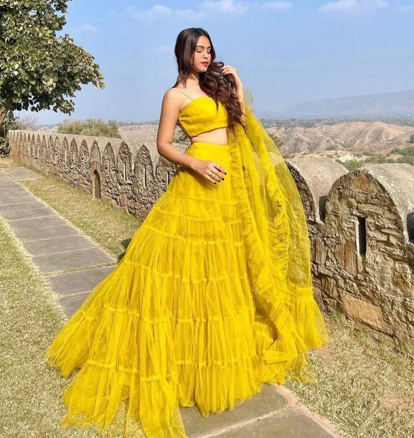 Yellow color designer ruffle lehenga choli - Joshindia