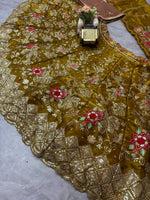 Olive green lehenga lower border embroidery close up