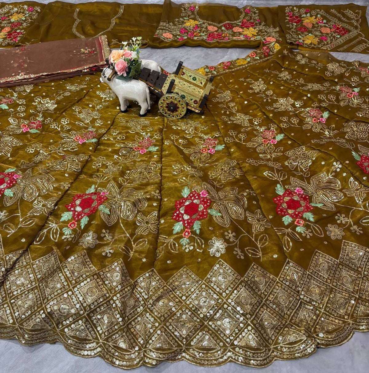 Back view of embroidered blouse with Jimmy Choo fabric, mehendi green