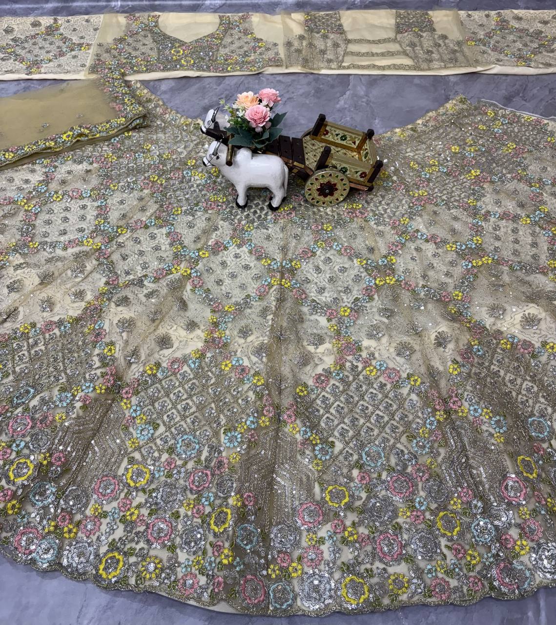 Elegant Cream Sequins EmbroideredLehenga Choli
