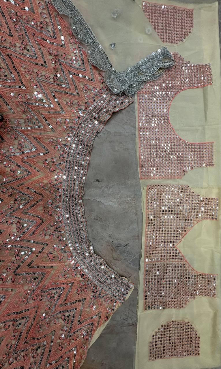 Peach Sequins Embroidered Soft Net Lehenga Choli