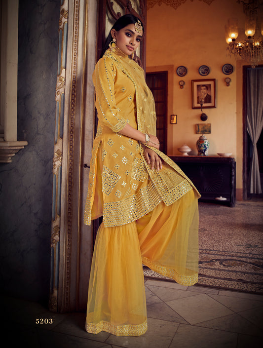 Attractive yellow color mirror work sharara suit for haldi function