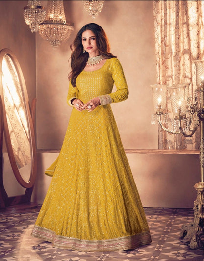 Yellow color fancy designer gown for wedding functions