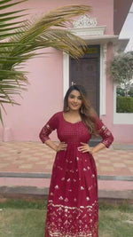 maroon color gown made of georgette material embellished with sequins and thread work.