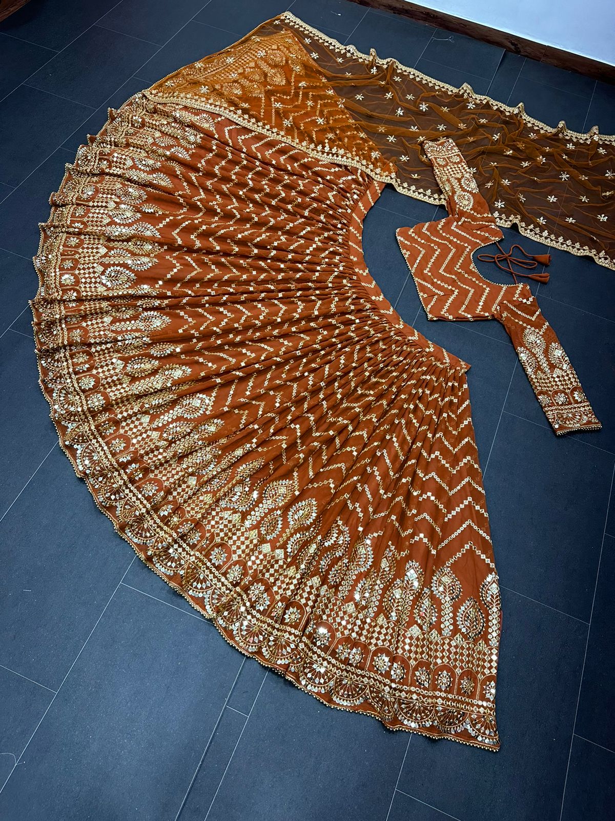 Orange color trendy designer lehenga choli for attractive looks - Joshindia