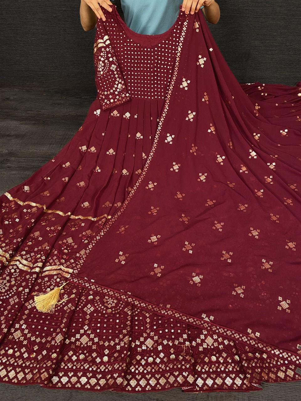 maroon color gown made of georgette material embellished with sequins and thread work. - Joshindia