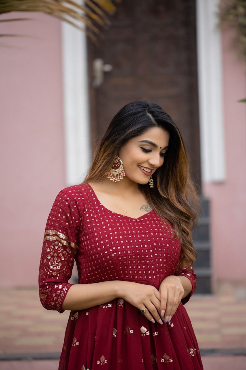 maroon color gown made of georgette material embellished with sequins and thread work. - Joshindia