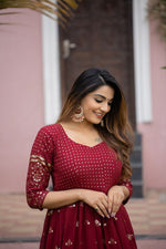 maroon color gown made of georgette material embellished with sequins and thread work. - Joshindia
