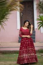 maroon color gown made of georgette material embellished with sequins and thread work. - Joshindia