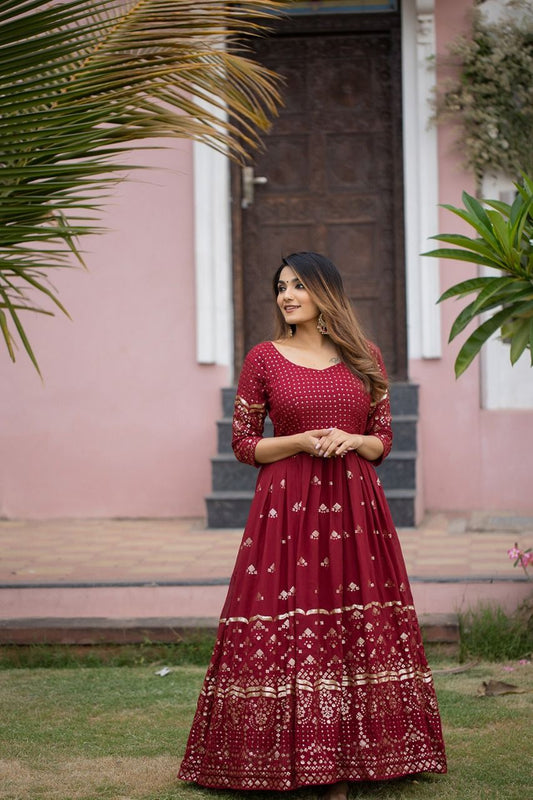 maroon color gown made of georgette material embellished with sequins and thread work.
