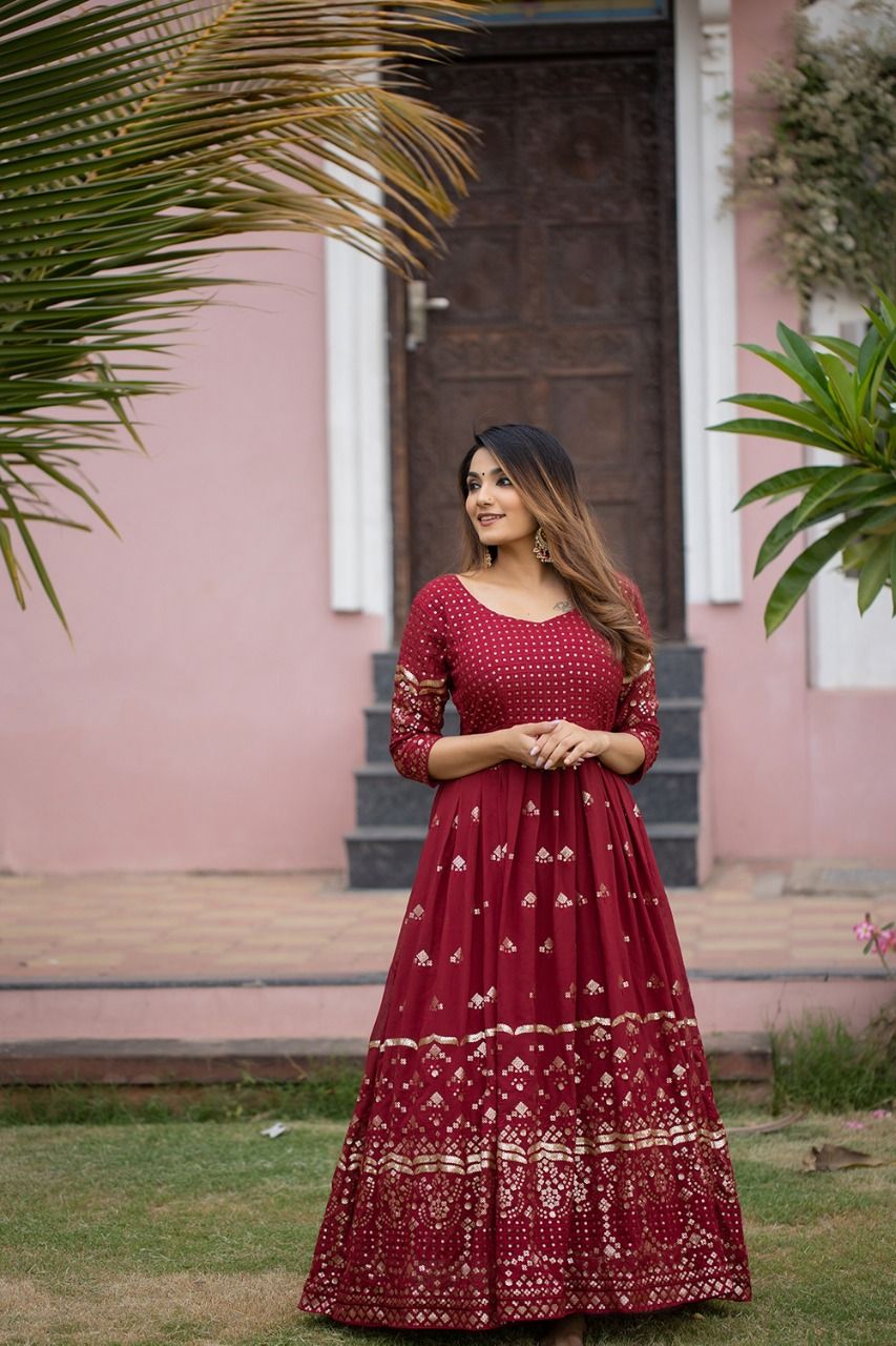 maroon color gown made of georgette material embellished with sequins and thread work. - Joshindia